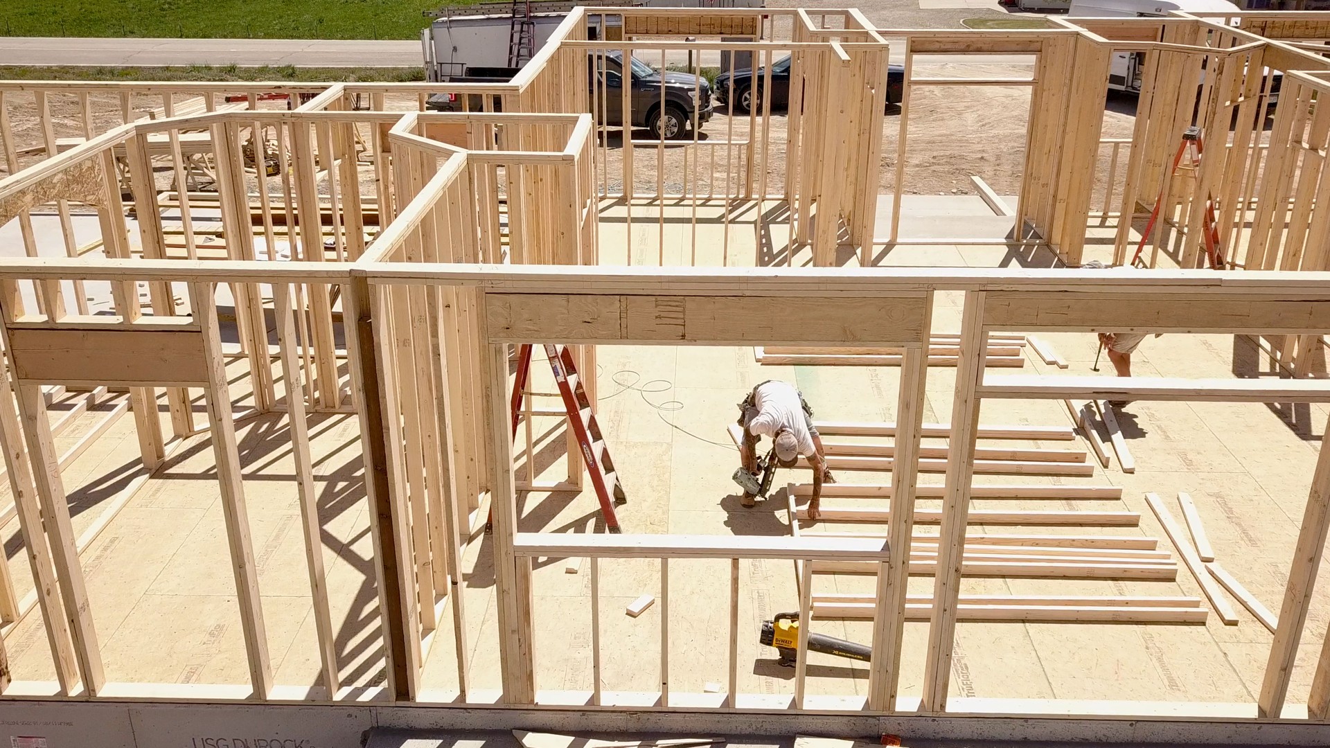 Drone View of a Home being Framed by Carpenters